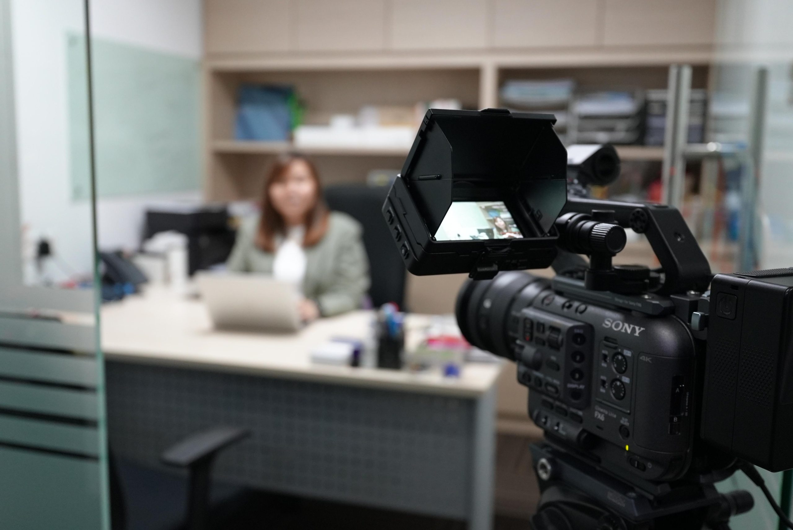 filimng-woman-on-a-desk